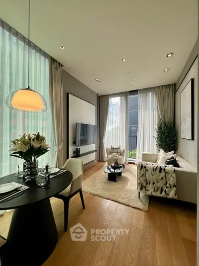 Luxurious modern living room with elegant decor and large windows offering natural light.