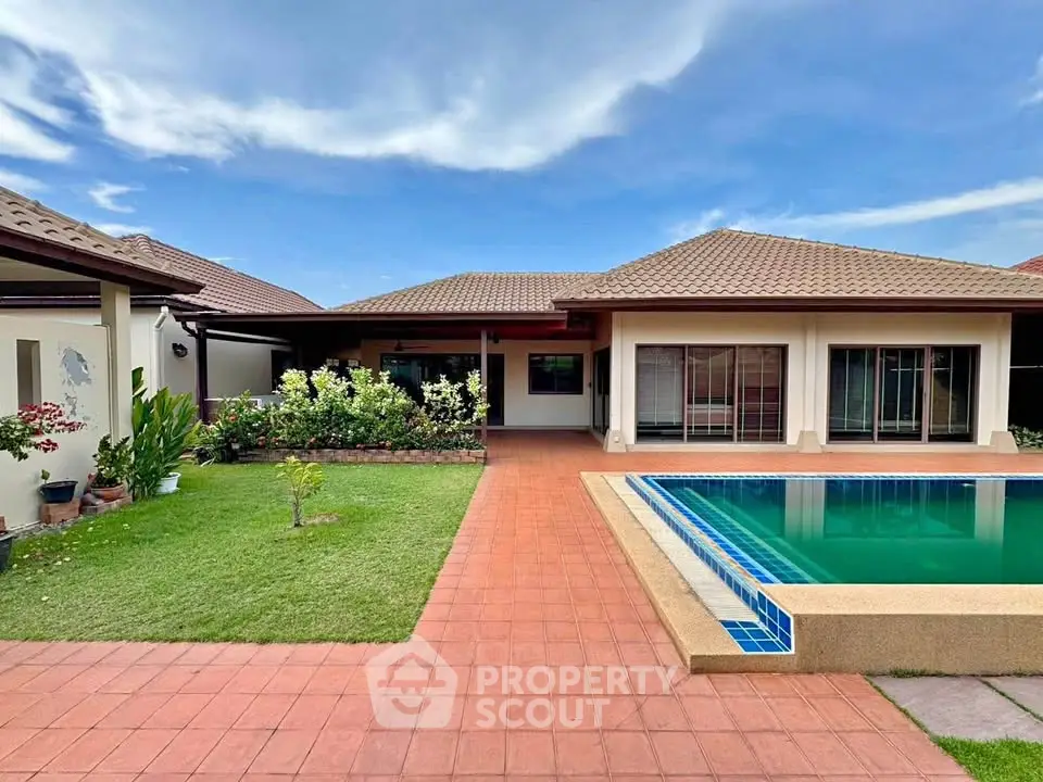 Charming single-story home with pool and garden, perfect for family living.