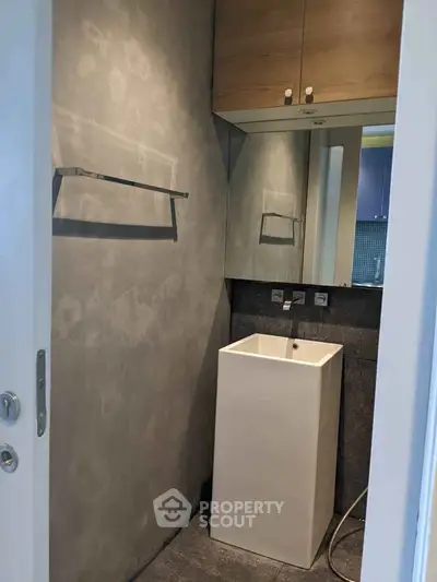 Modern minimalist bathroom with sleek sink and stylish cabinetry