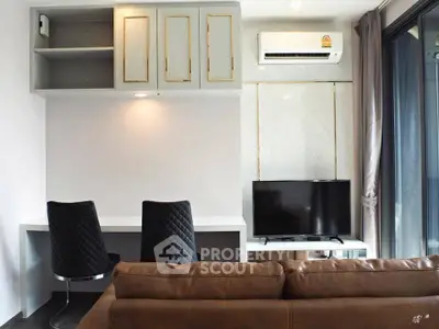 Modern living room with sleek furniture and built-in storage, featuring a cozy sofa and flat-screen TV.