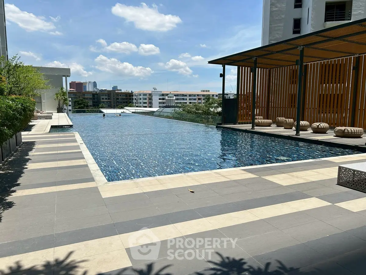 Luxurious rooftop pool with city views and modern design, perfect for relaxation and leisure.