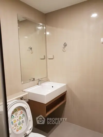 Modern bathroom with sleek sink and mirror in minimalist design