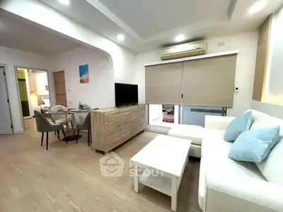 Modern living room with stylish furniture and natural light