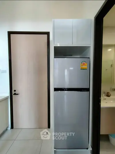 Modern kitchen with sleek refrigerator and minimalist design