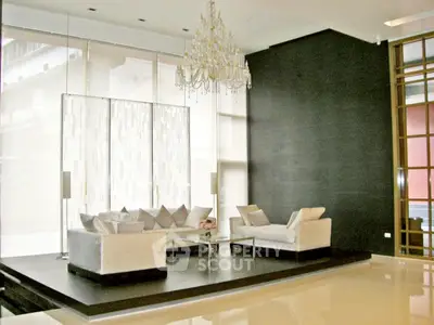 Luxurious modern living room with elegant chandelier and stylish furniture