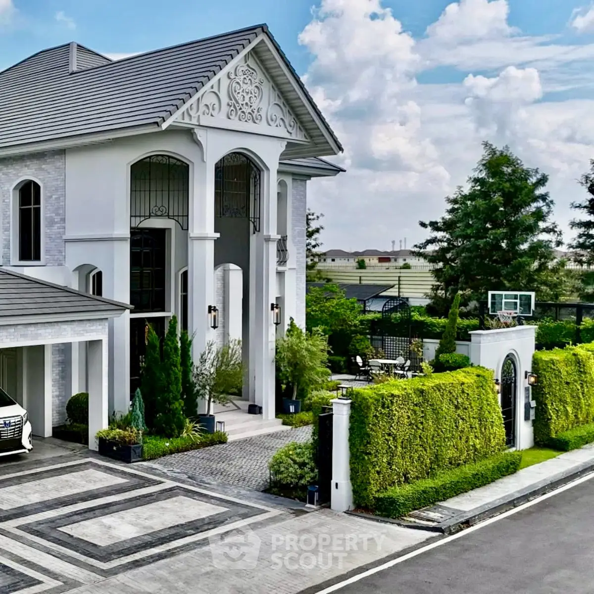 Luxurious modern mansion with elegant facade and lush landscaping