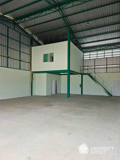 Spacious industrial warehouse with mezzanine office and high ceilings