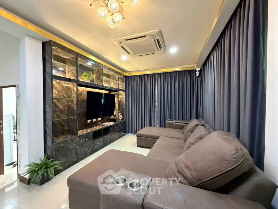 Luxurious living room with elegant decor and spacious seating area.