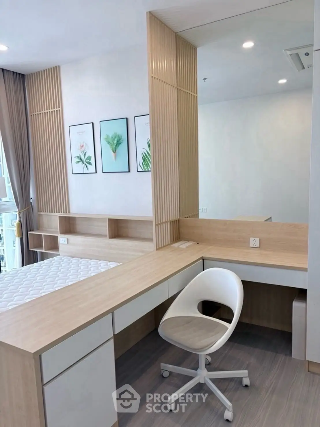 Modern study area with sleek desk and comfortable chair in bright apartment