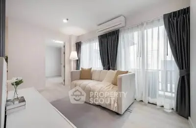 Bright and cozy living room with modern sofa and large windows