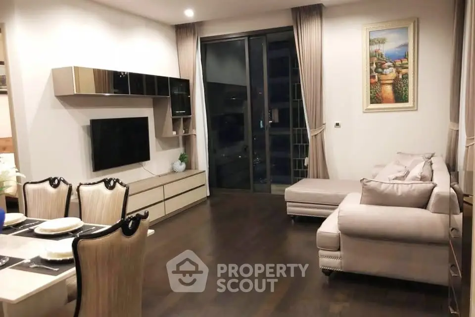 Elegant living room with modern decor and large windows for natural light.