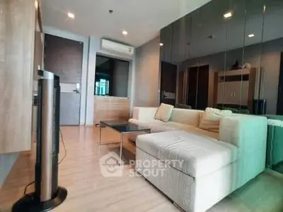 Modern living room with stylish decor and comfortable seating in a contemporary apartment.