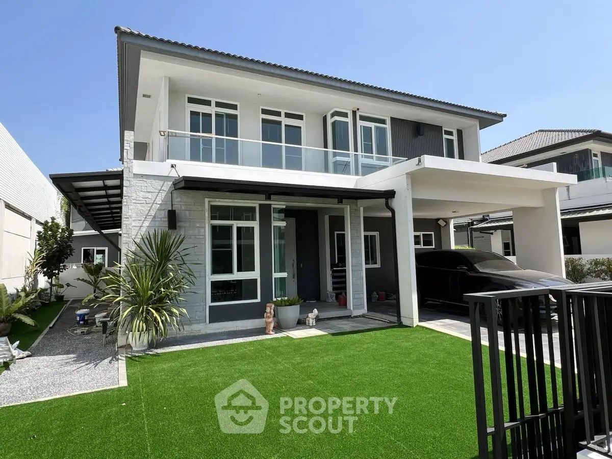 Modern two-story house with sleek design and spacious driveway