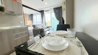 Modern open-plan living and dining area with stylish decor and natural light.