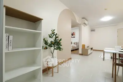 Spacious open-plan living area with modern decor and elegant flooring