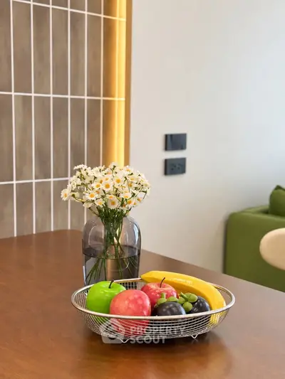 Modern kitchen with elegant decor and fruit basket on wooden countertop