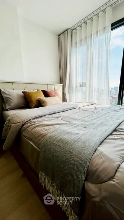 Modern bedroom with city view and elegant decor