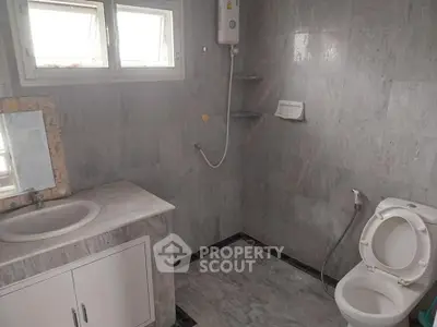 Spacious bathroom with modern fixtures and natural light