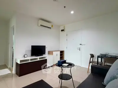Modern living room with sleek furniture and air conditioning in a stylish apartment.