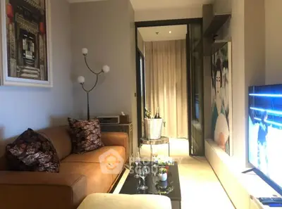 Stylish living room with modern decor and cozy seating area, perfect for relaxation and entertainment.