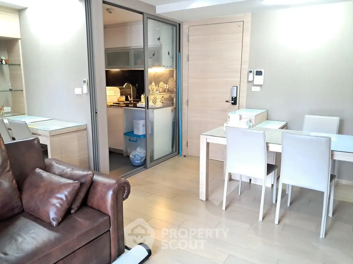 Modern living room with open kitchen and stylish furniture