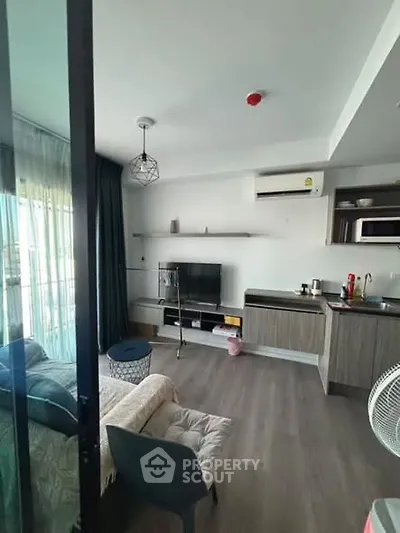 Modern living room with open kitchen and stylish decor