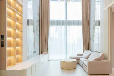 Luxurious modern living room with high ceilings and elegant decor