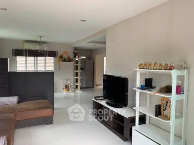 Spacious living room with modern decor and ample natural light