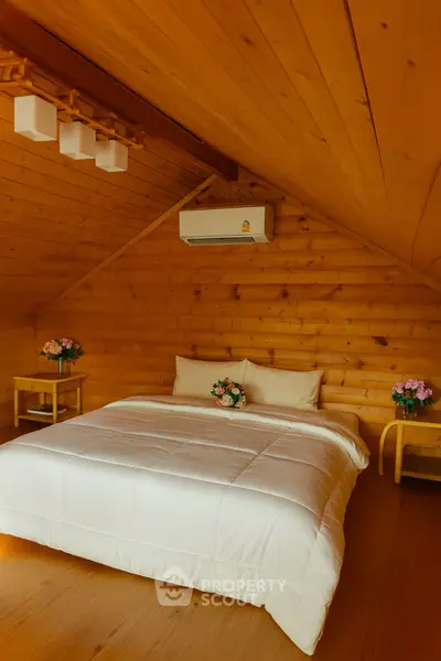 Cozy wooden bedroom with modern air conditioning and elegant floral decor