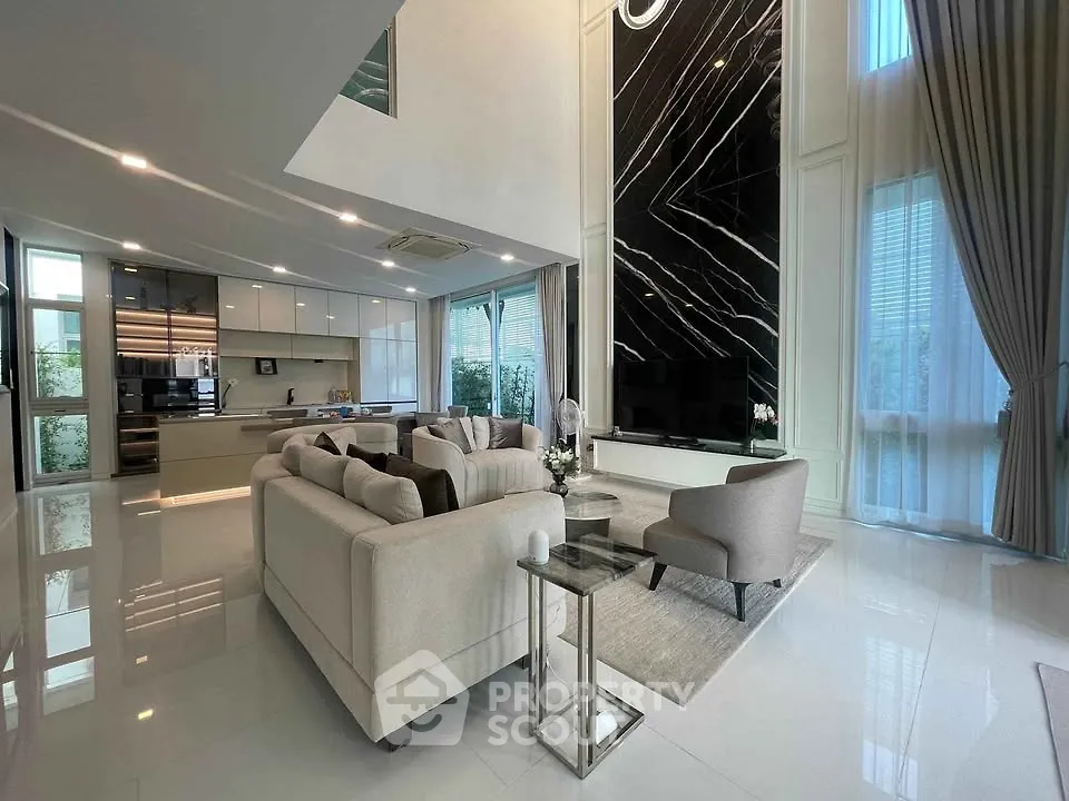 Luxurious modern living room with high ceilings and elegant decor