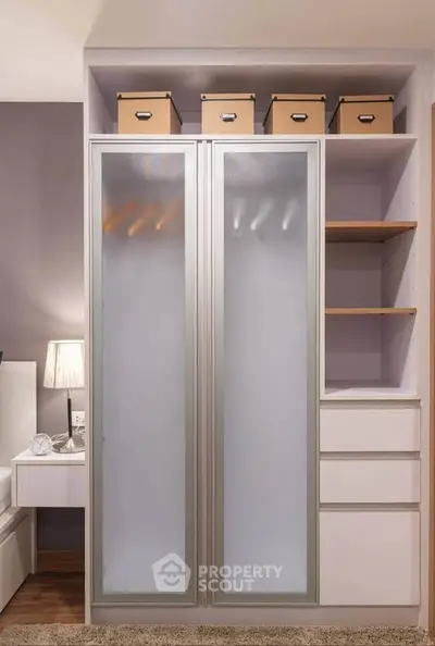 Modern bedroom with sleek wardrobe and ambient lighting