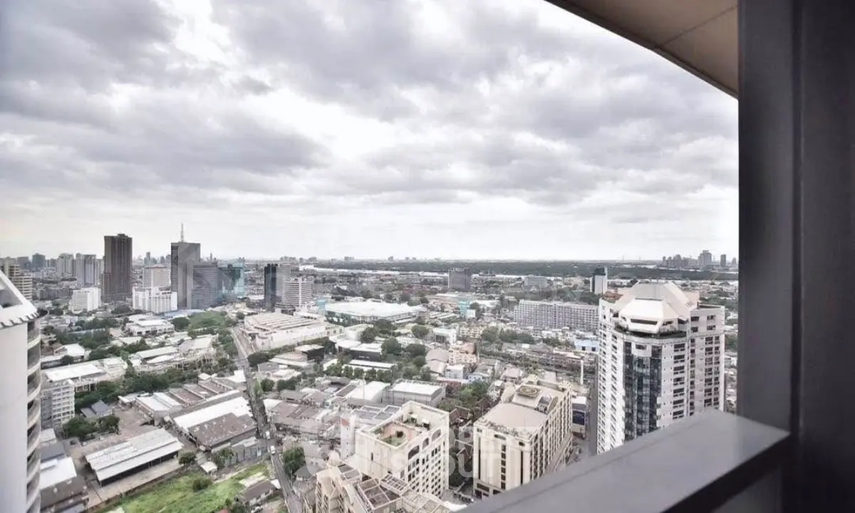 Stunning cityscape view from high-rise balcony with expansive skyline.