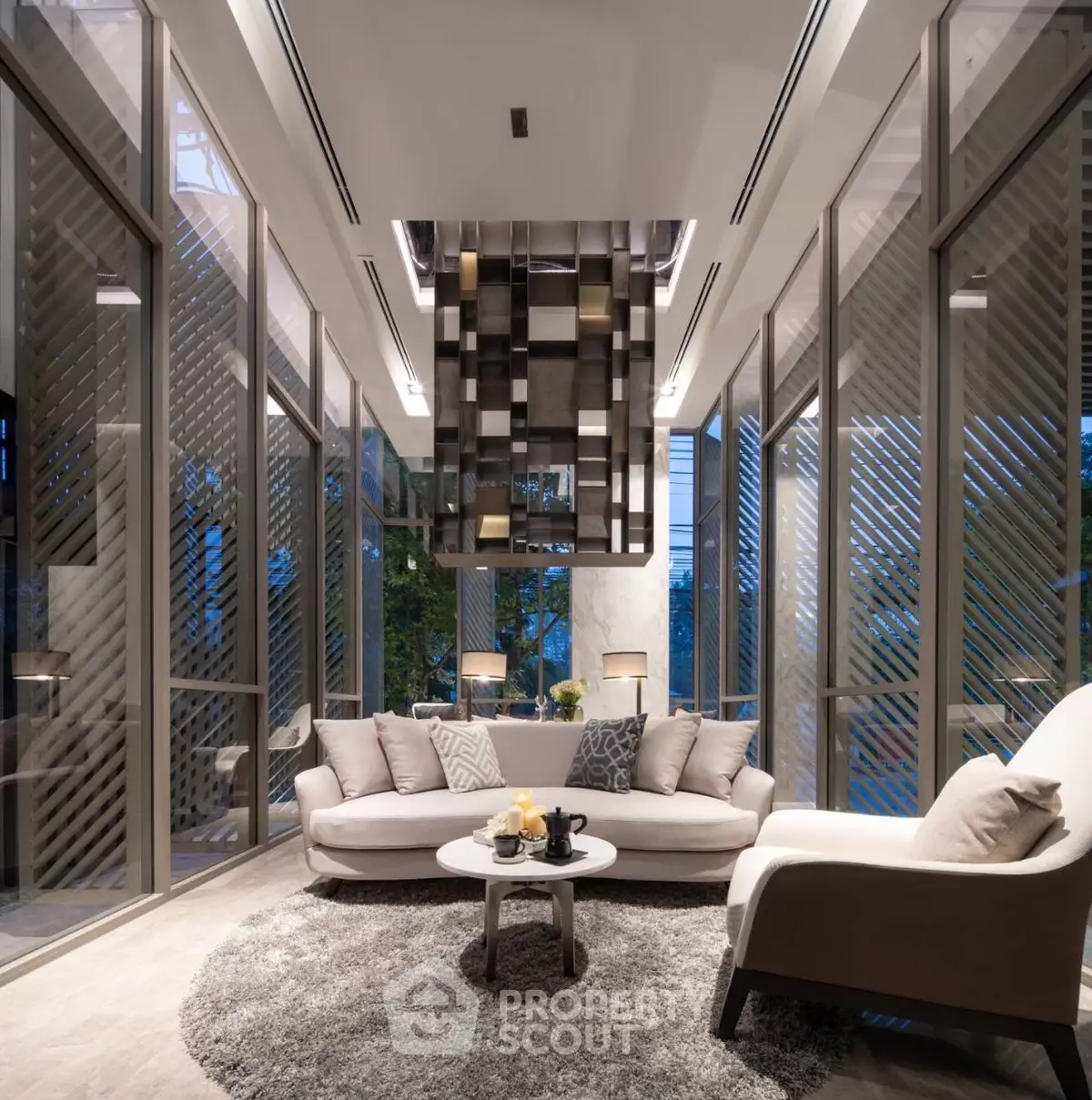 Luxurious modern living room with floor-to-ceiling windows and elegant decor