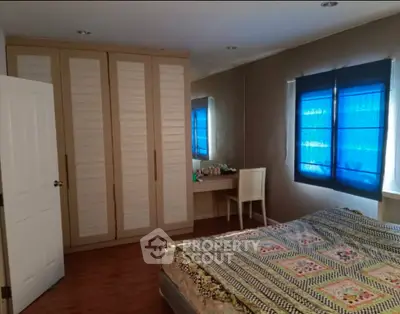 Cozy bedroom with large wardrobe and stylish decor