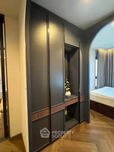 Modern bedroom with stylish built-in wardrobe and elegant decor