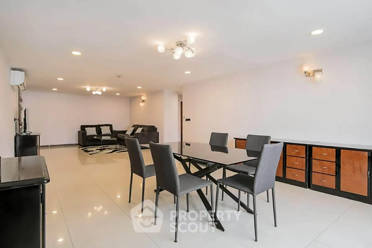 Spacious modern living room with elegant dining area and stylish lighting