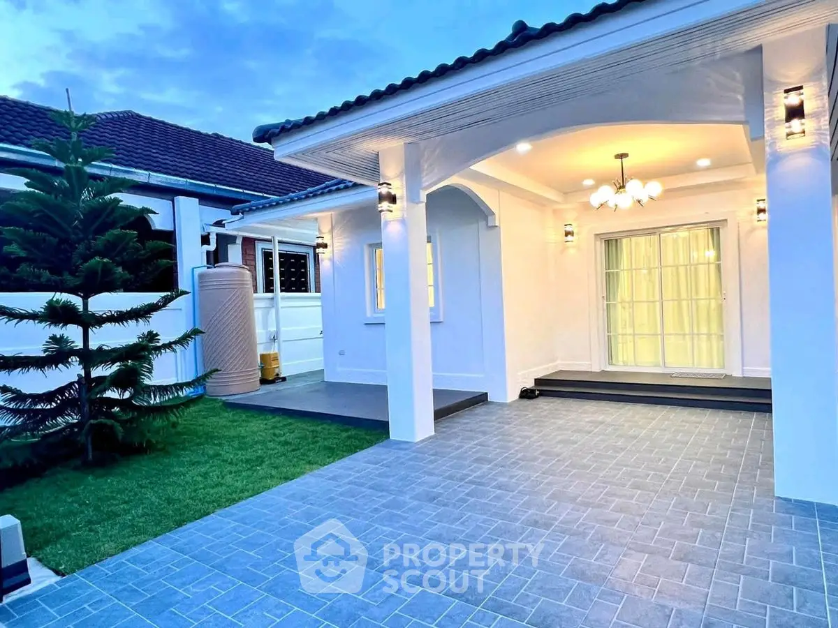 Charming single-story home with elegant entrance and well-maintained garden, perfect for family living.