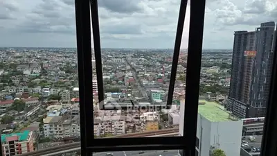 Stunning cityscape view from high-rise building window with expansive skyline.