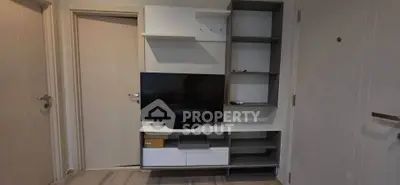 Modern living room with sleek TV unit and stylish shelving, perfect for contemporary urban living.