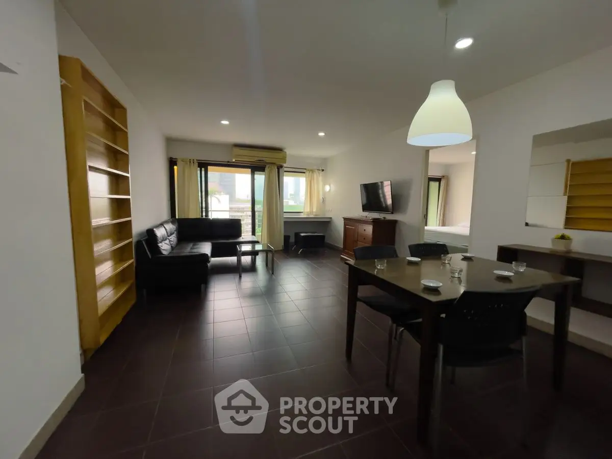 Spacious living room with modern furniture and large windows for natural light.