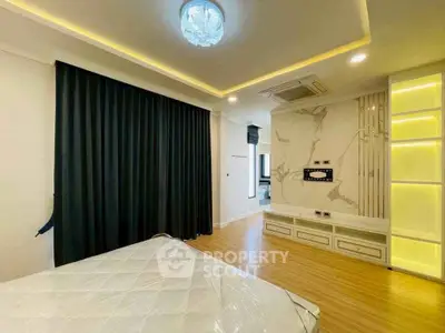 Modern bedroom with elegant lighting and stylish decor