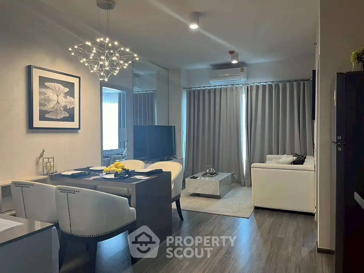 Modern living room with elegant dining area and stylish lighting