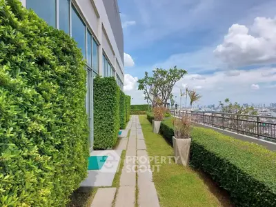 Stunning rooftop garden with panoramic city views and lush greenery, perfect for relaxation and entertainment.