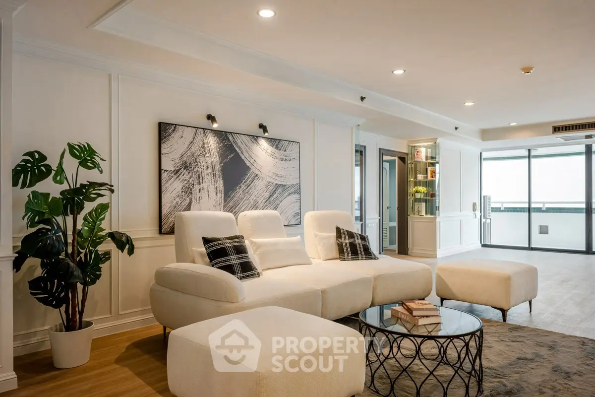 Luxurious living room with modern decor and large windows for natural light