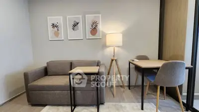 Modern living room with stylish furniture and elegant decor in a cozy apartment setting.