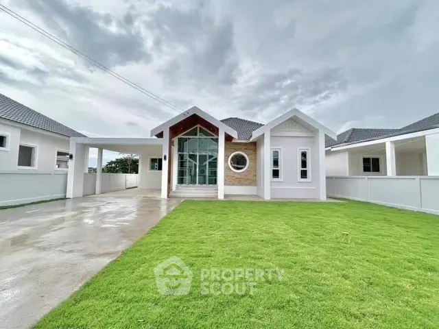 Stunning modern house with lush green lawn and spacious driveway