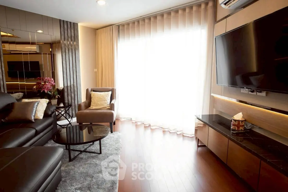 Luxurious modern living room with sleek furniture and large TV