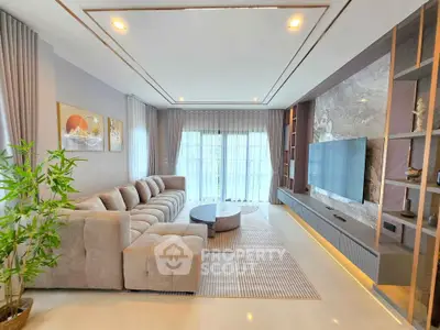 Luxurious modern living room with plush sectional sofa and large TV