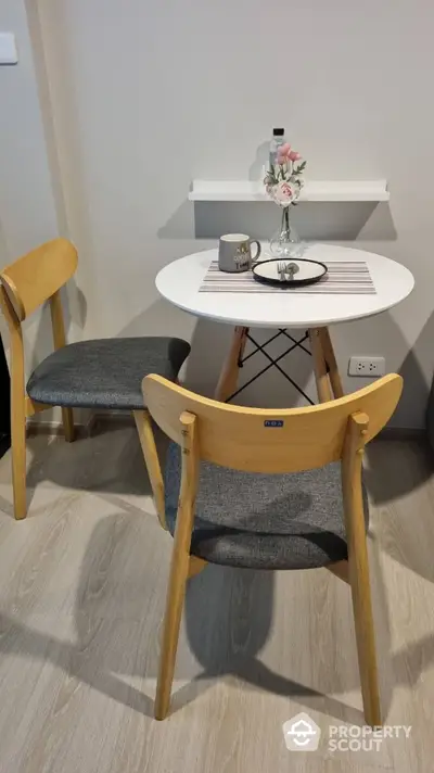 Cozy dining nook with modern table and chairs in stylish apartment