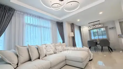 Luxurious modern living room with elegant lighting and spacious seating area